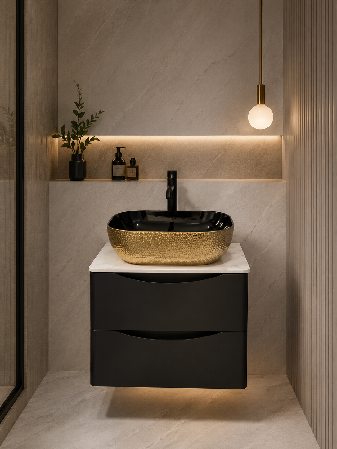 Gold hammered vessel basin on black wall-hung vanity with marble top